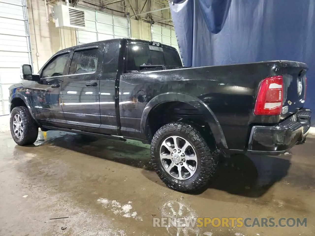 2 Photograph of a damaged car 3C6UR5PL8PG591647 RAM 2500 2023