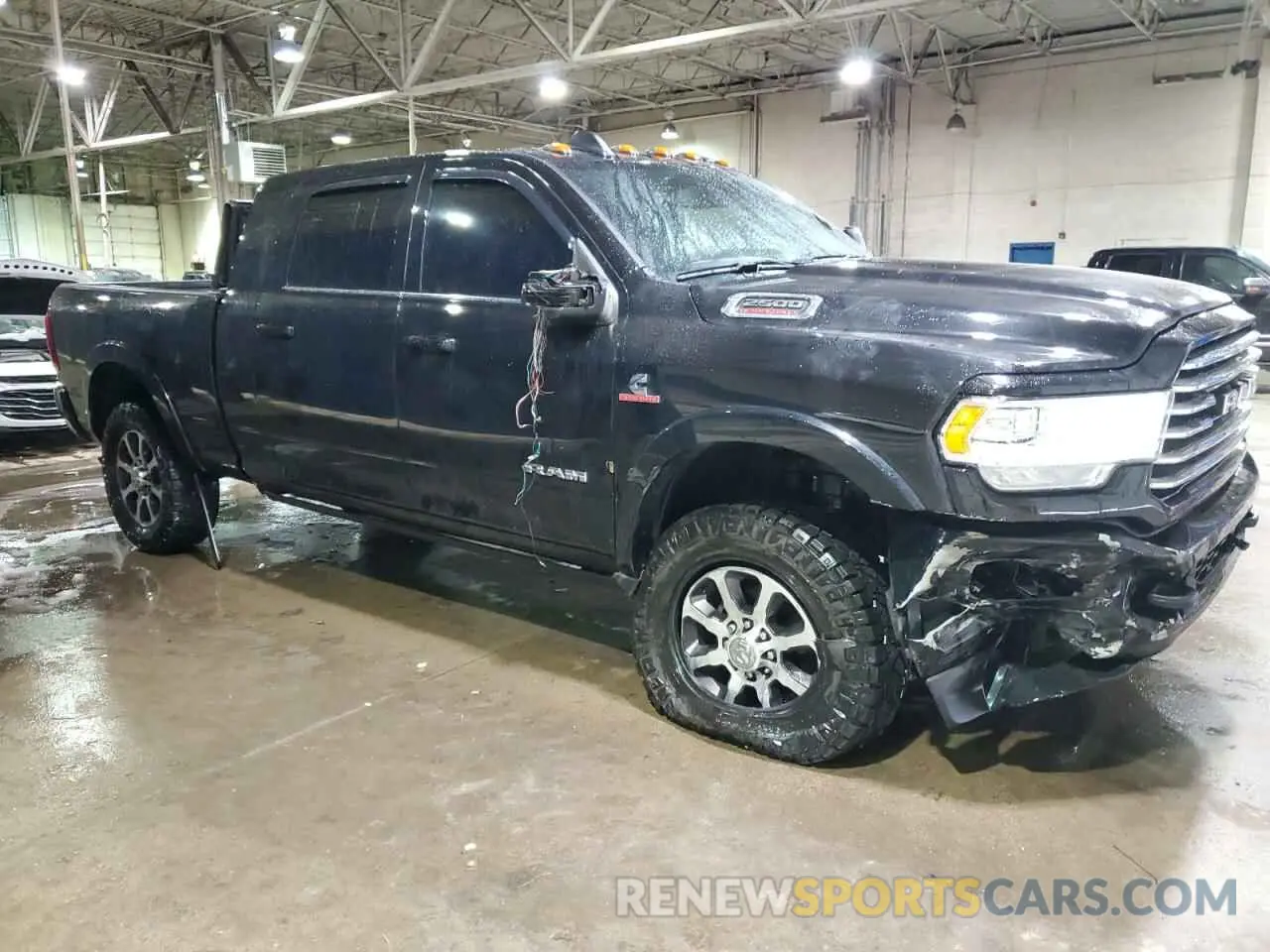 4 Photograph of a damaged car 3C6UR5PL8PG591647 RAM 2500 2023