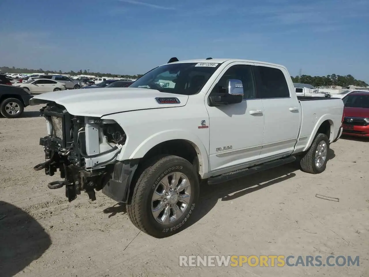 2 Photograph of a damaged car 3C6UR5SL4PG612906 RAM 2500 2023