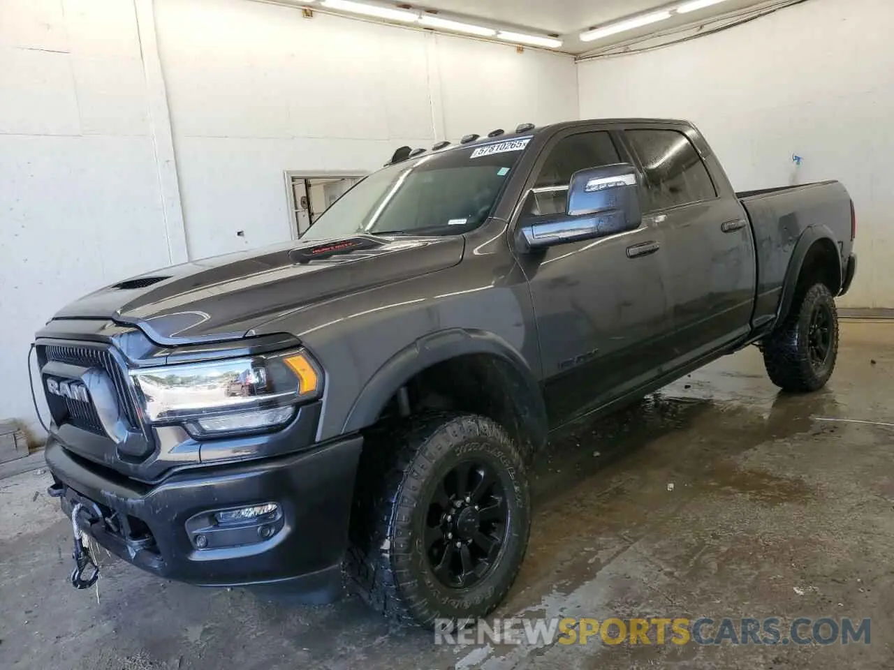 1 Photograph of a damaged car 3C6TR5EJ8RG130481 RAM 2500 2024