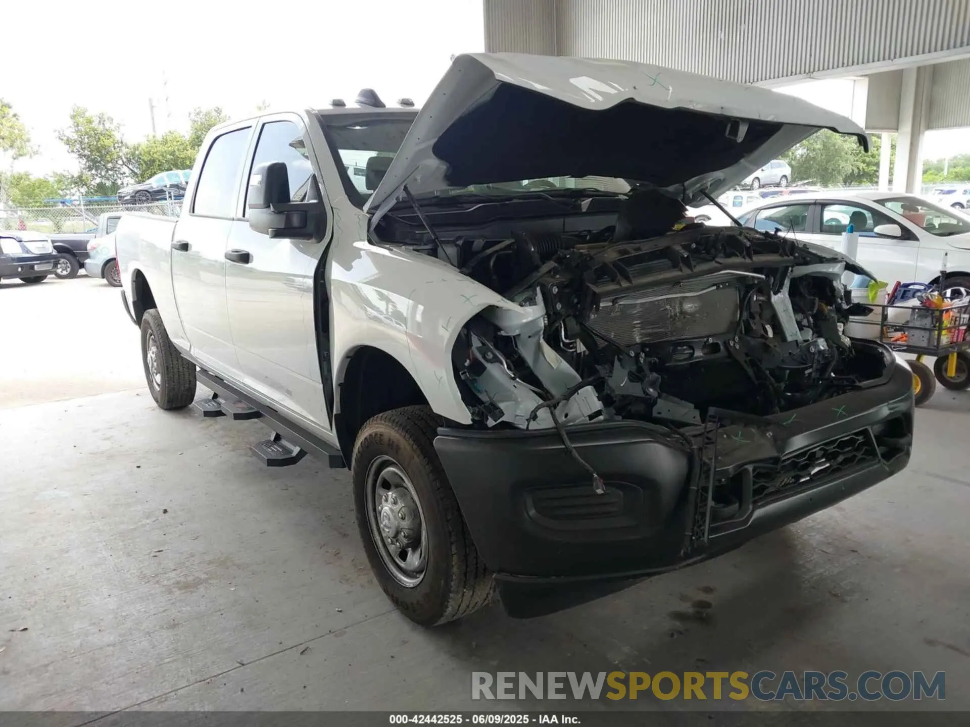 1 Photograph of a damaged car 3C6UR5CJ4RG267621 RAM 2500 2024