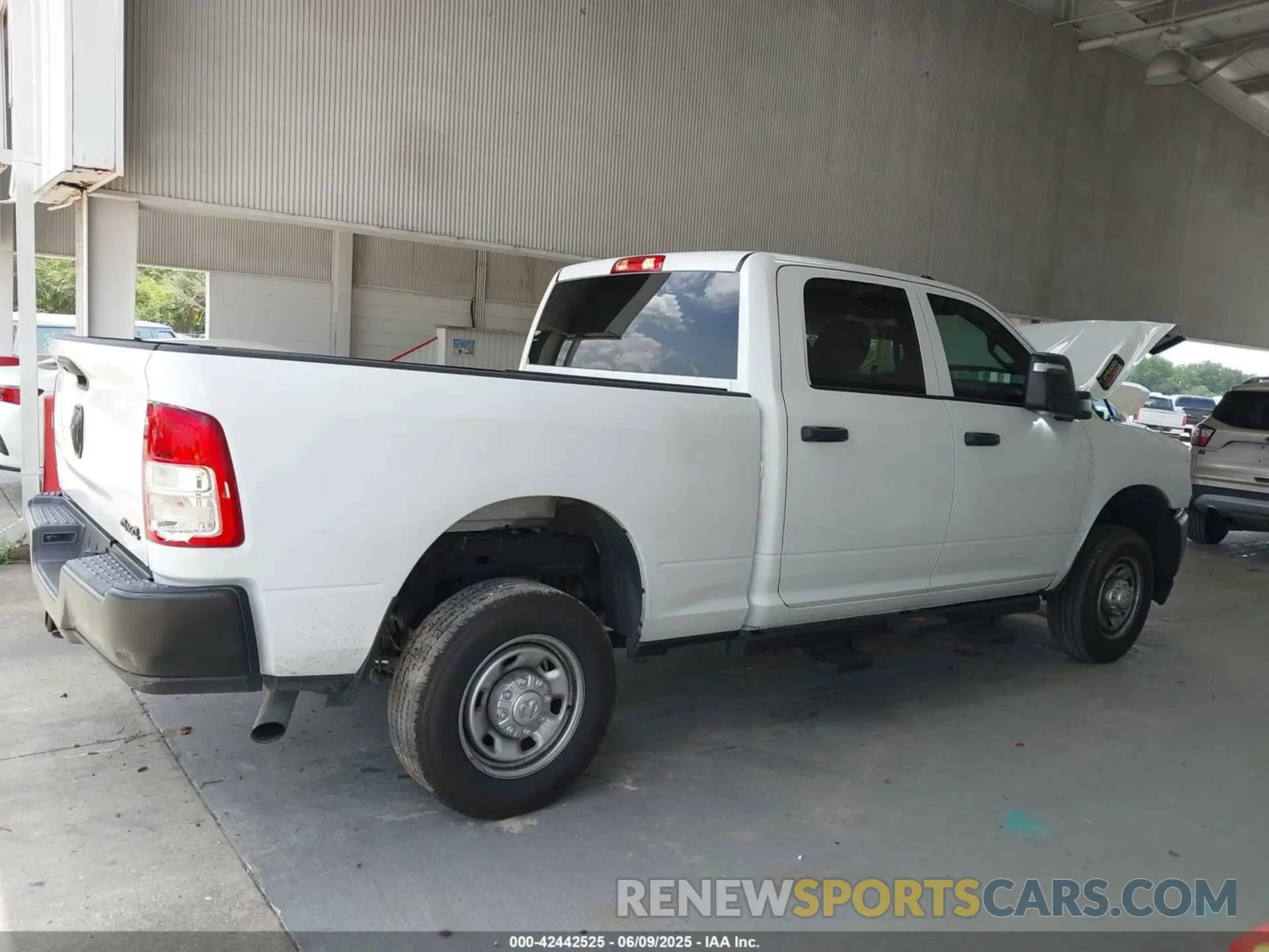 14 Photograph of a damaged car 3C6UR5CJ4RG267621 RAM 2500 2024