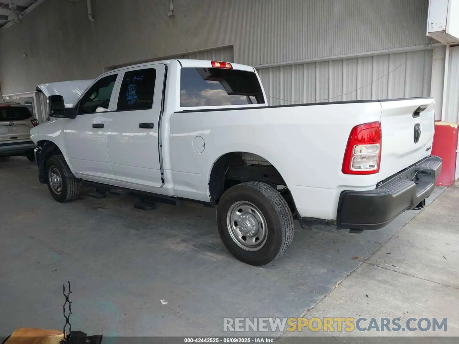 3 Photograph of a damaged car 3C6UR5CJ4RG267621 RAM 2500 2024