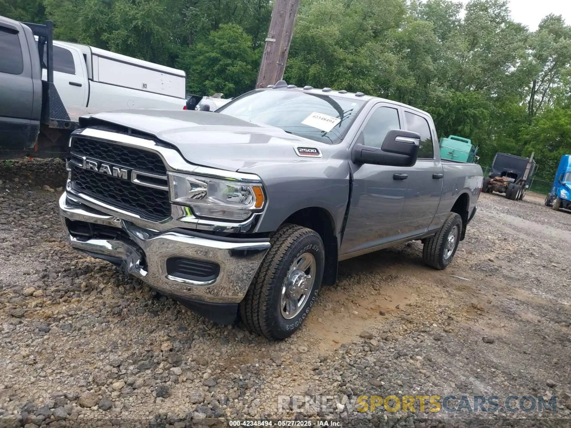 2 Photograph of a damaged car 3C6UR5CJ6RG252974 RAM 2500 2024