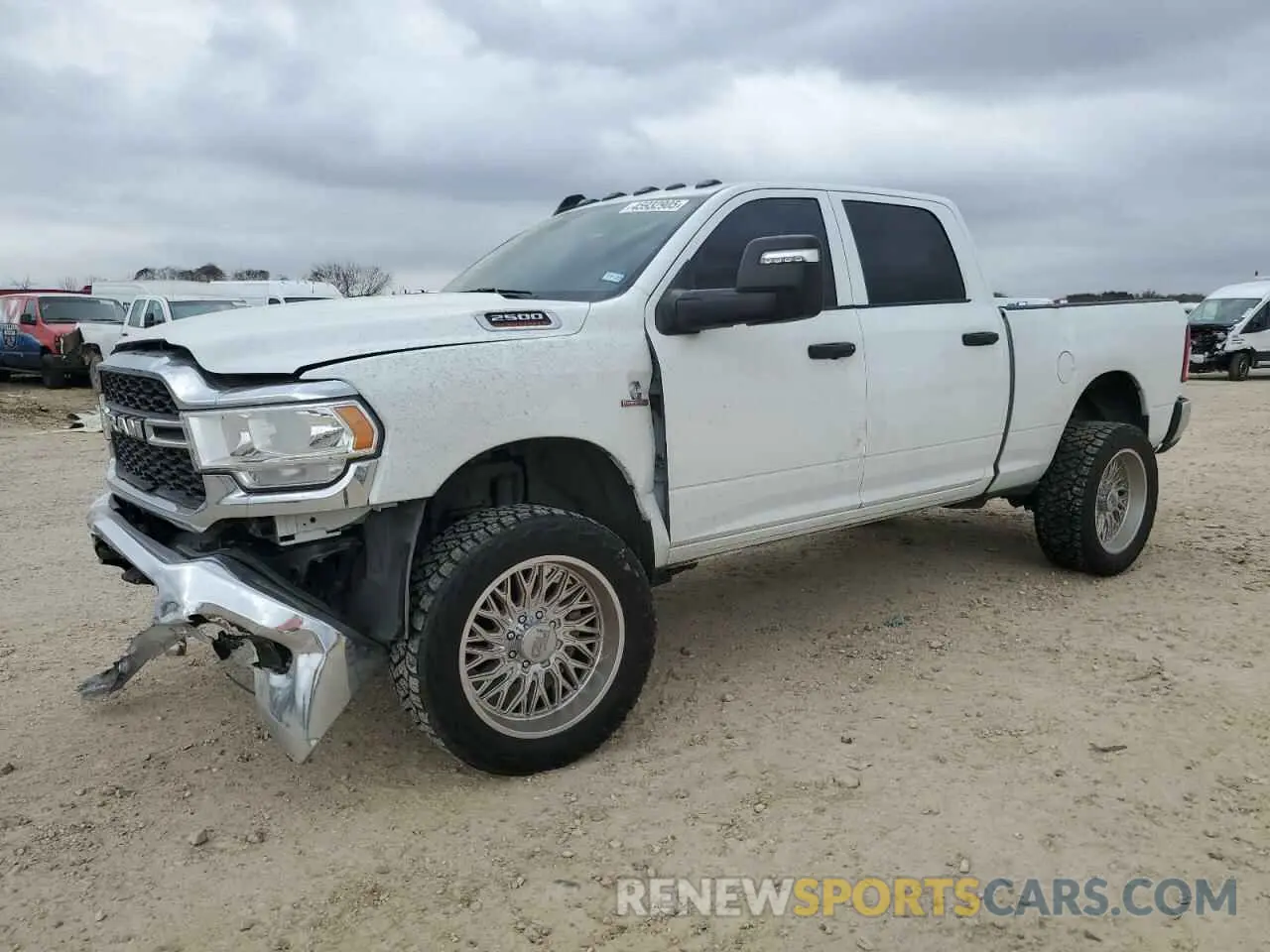 1 Photograph of a damaged car 3C6UR5CL0RG117345 RAM 2500 2024