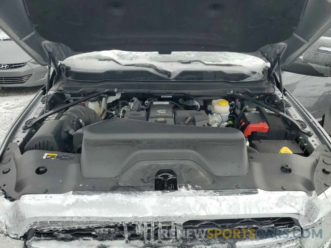 11 Photograph of a damaged car 3C6UR5CL1RG221519 RAM 2500 2024