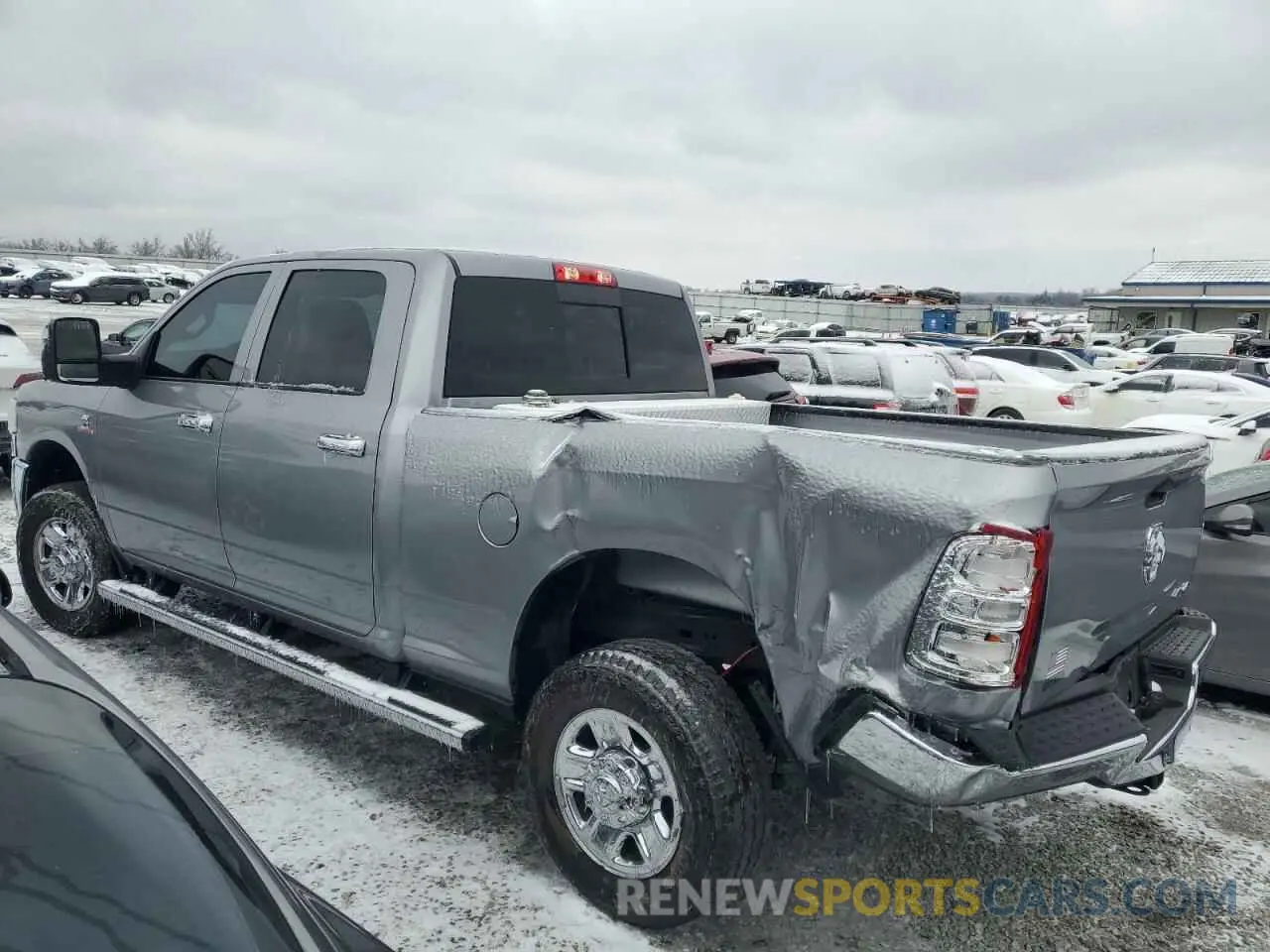2 Photograph of a damaged car 3C6UR5CL1RG221519 RAM 2500 2024