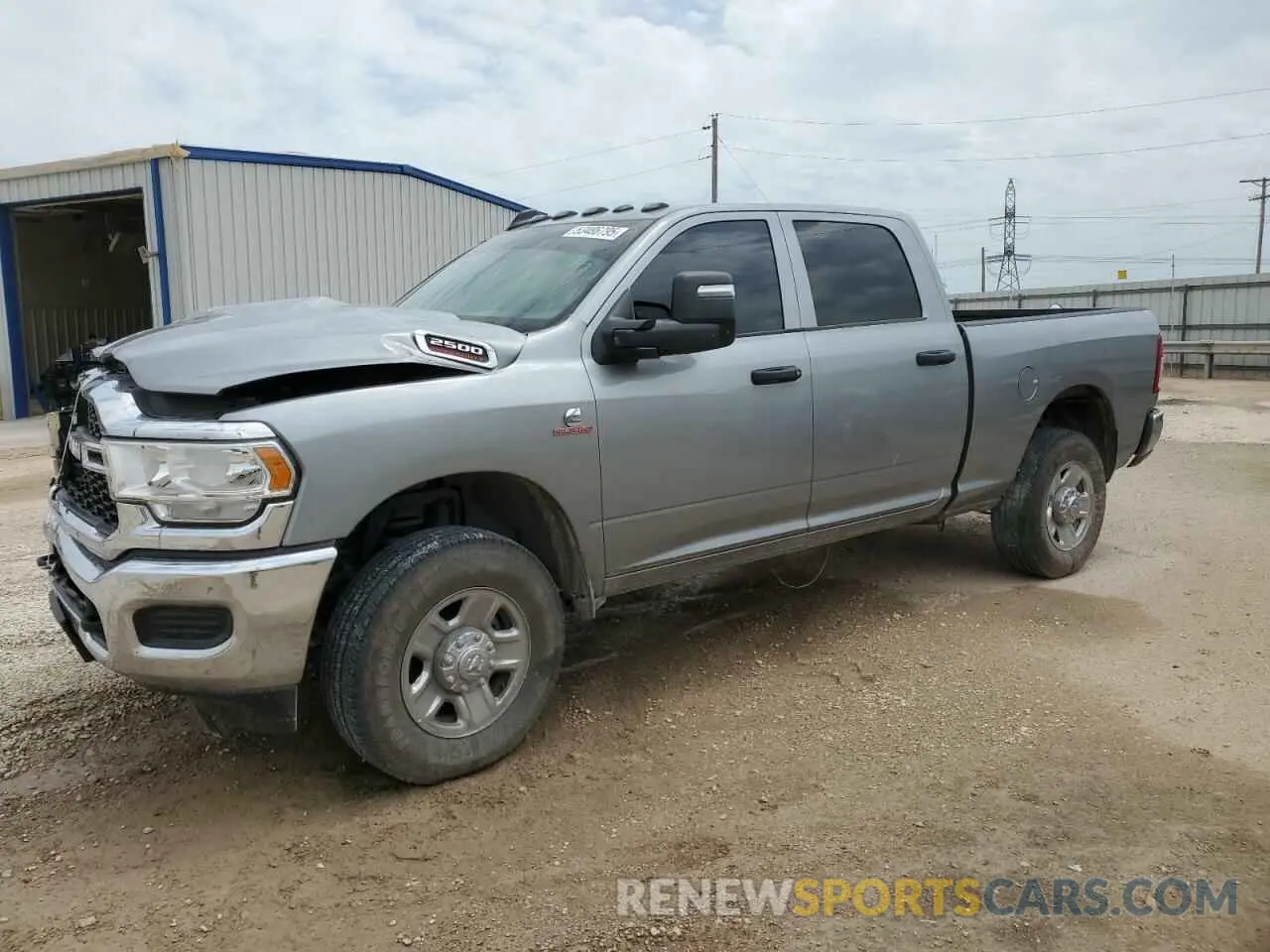 1 Photograph of a damaged car 3C6UR5CL1RG328893 RAM 2500 2024