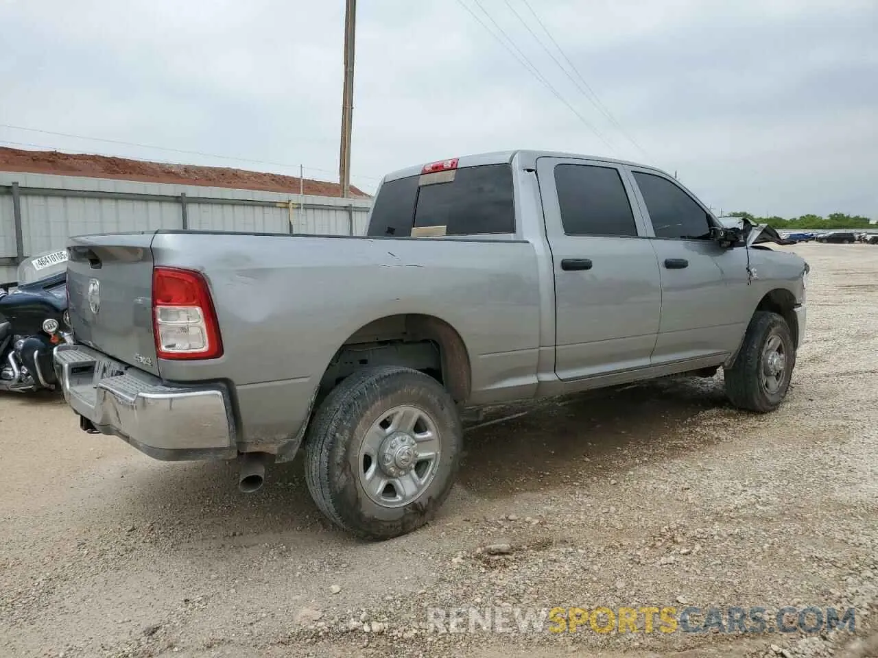 3 Photograph of a damaged car 3C6UR5CL1RG328893 RAM 2500 2024