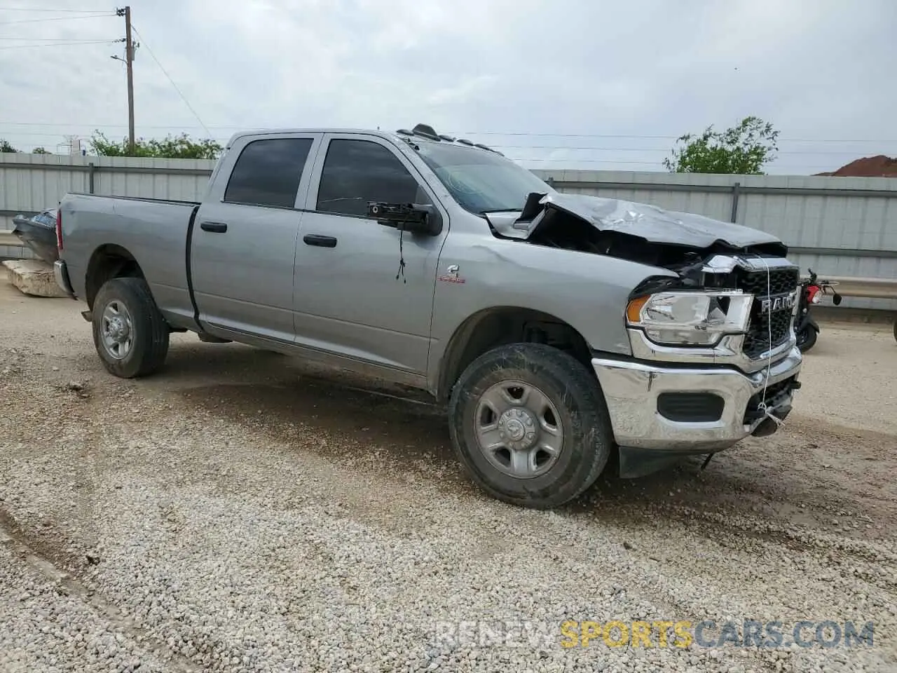 4 Photograph of a damaged car 3C6UR5CL1RG328893 RAM 2500 2024