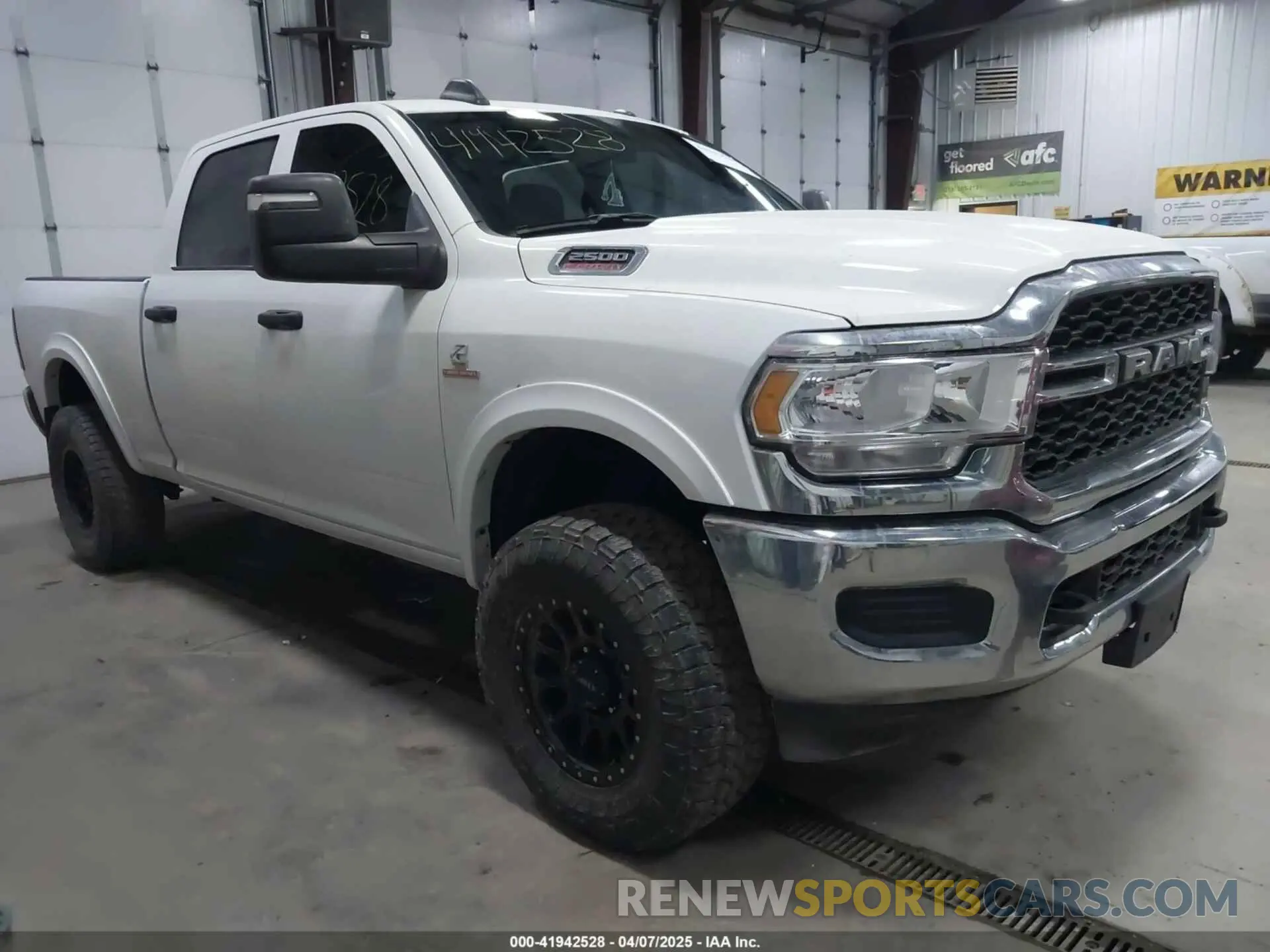 1 Photograph of a damaged car 3C6UR5CL3RG102516 RAM 2500 2024