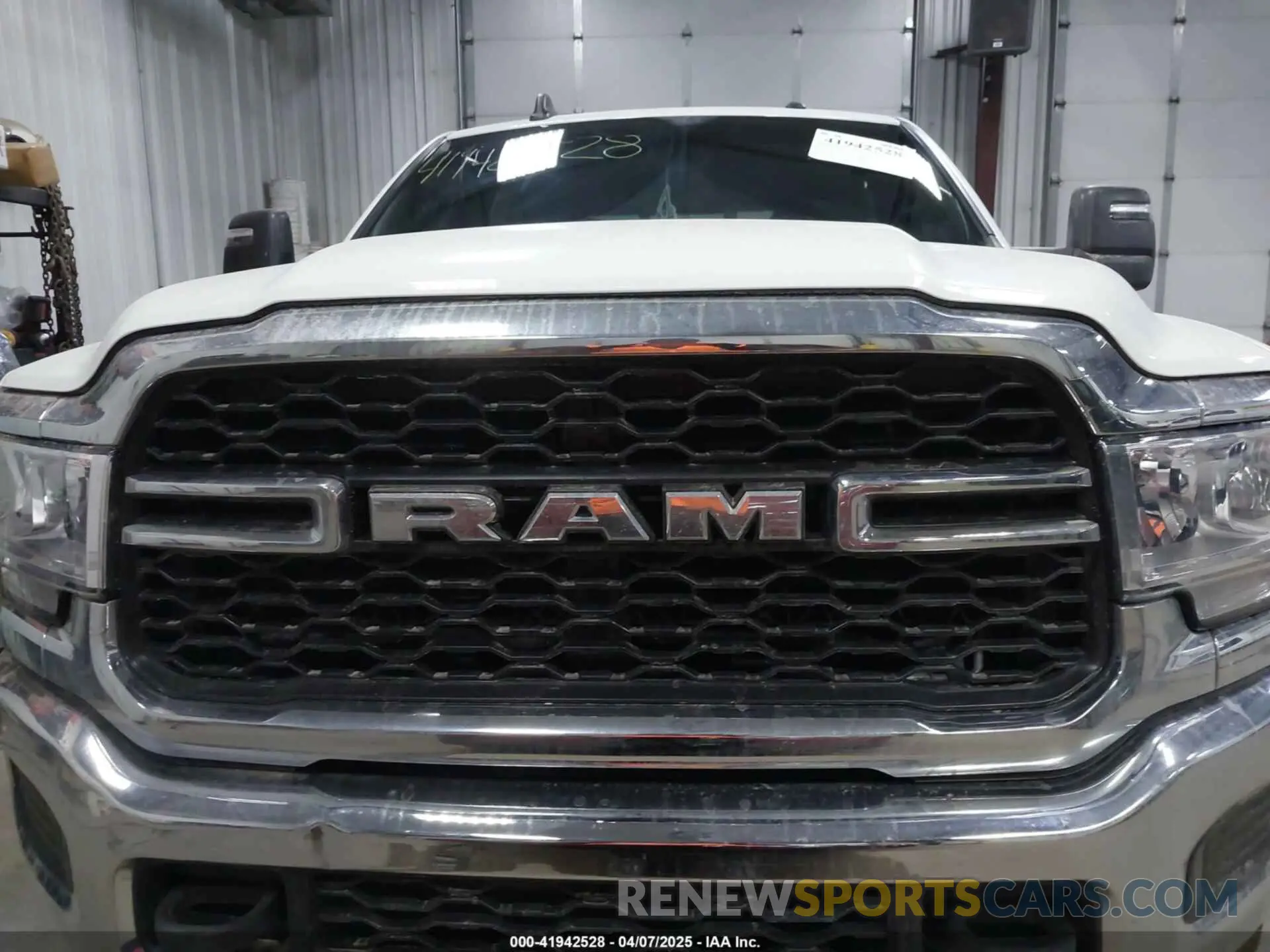 12 Photograph of a damaged car 3C6UR5CL3RG102516 RAM 2500 2024