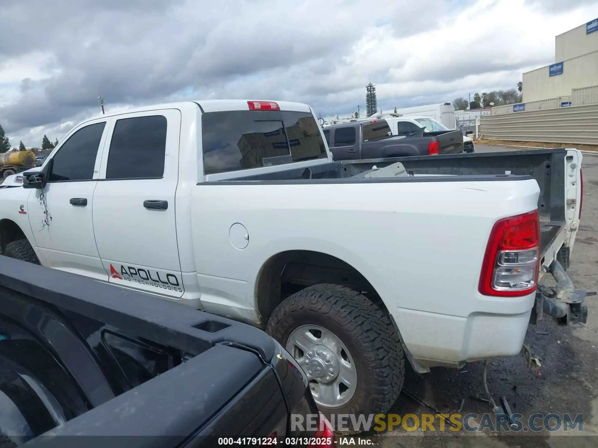 14 Photograph of a damaged car 3C6UR5CL3RG226527 RAM 2500 2024