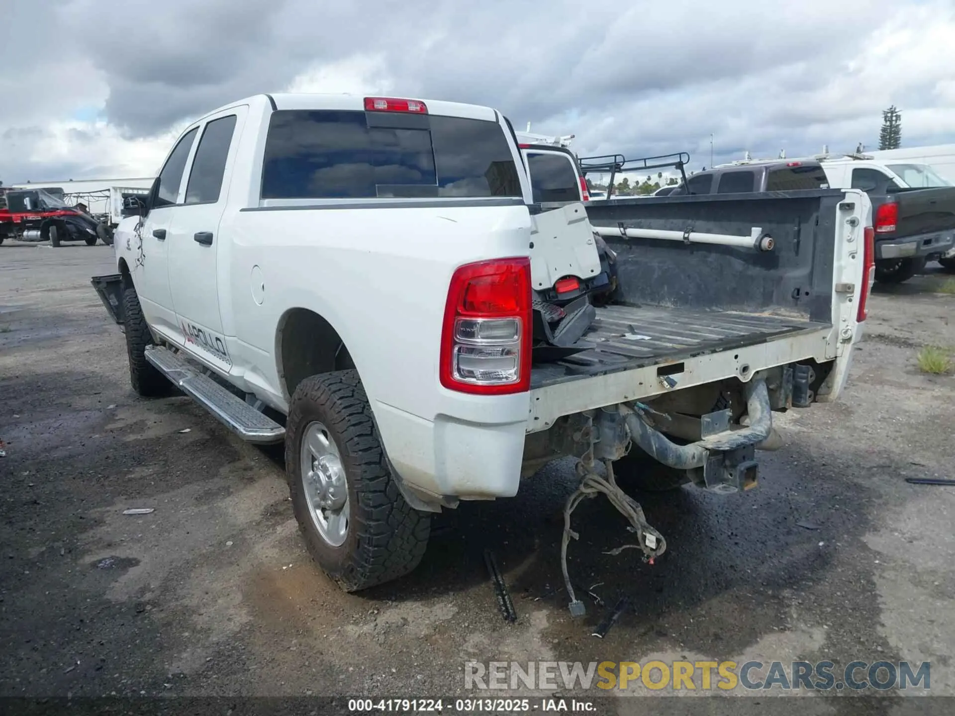 3 Photograph of a damaged car 3C6UR5CL3RG226527 RAM 2500 2024