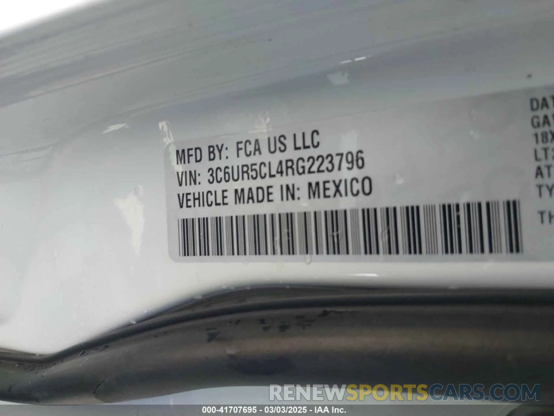 9 Photograph of a damaged car 3C6UR5CL4RG223796 RAM 2500 2024
