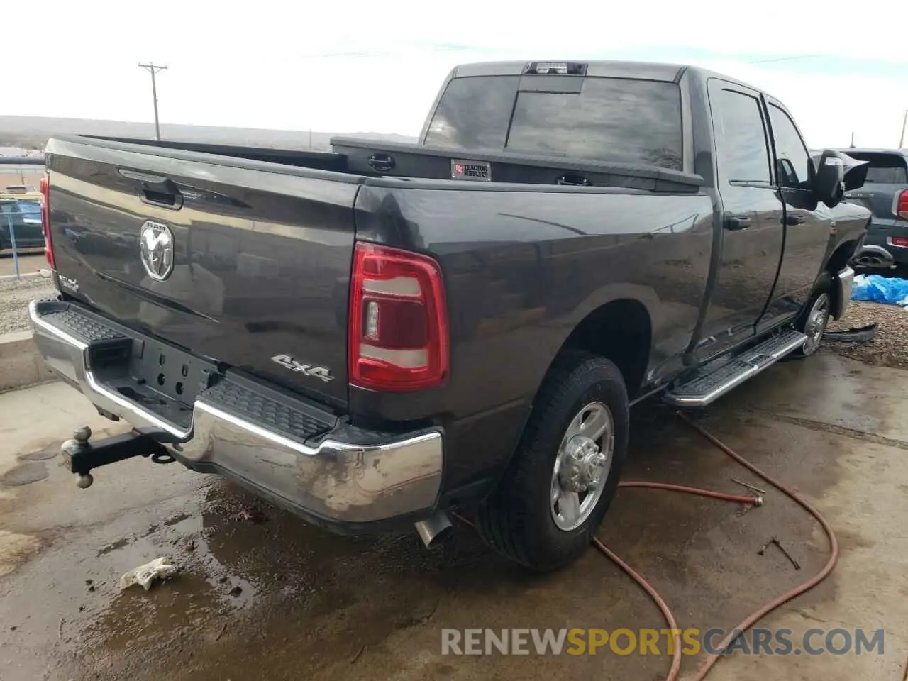 3 Photograph of a damaged car 3C6UR5CL4RG356686 RAM 2500 2024