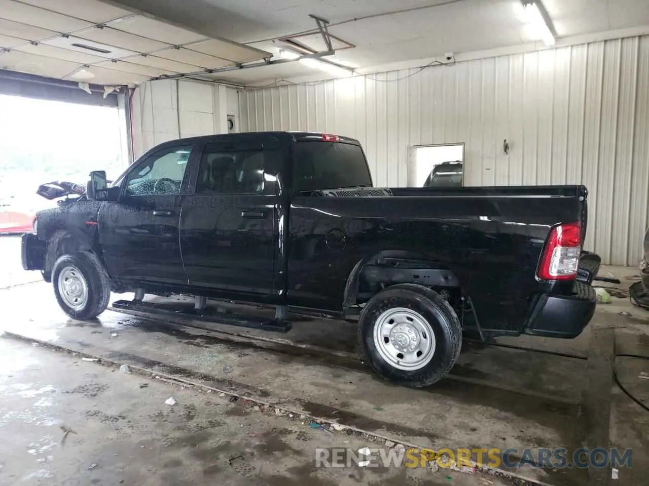 2 Photograph of a damaged car 3C6UR5CL4RG375481 RAM 2500 2024