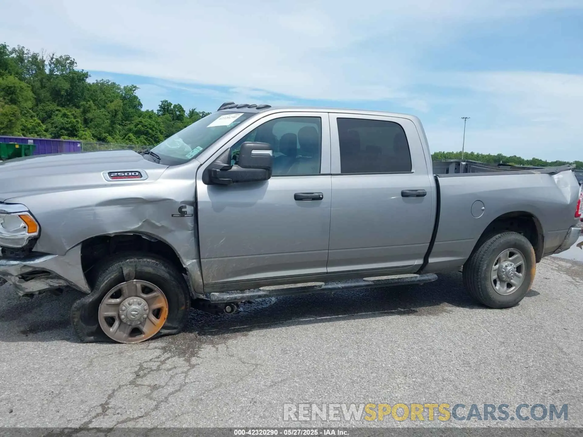 14 Photograph of a damaged car 3C6UR5CL7RG294071 RAM 2500 2024