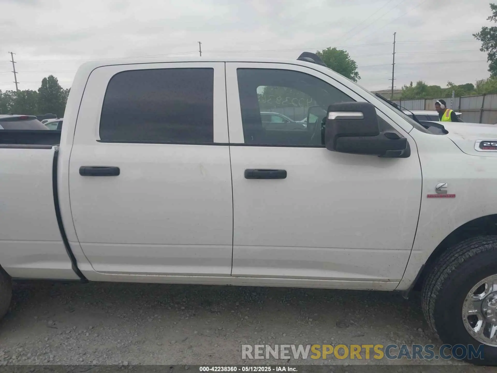 14 Photograph of a damaged car 3C6UR5CL7RG309801 RAM 2500 2024