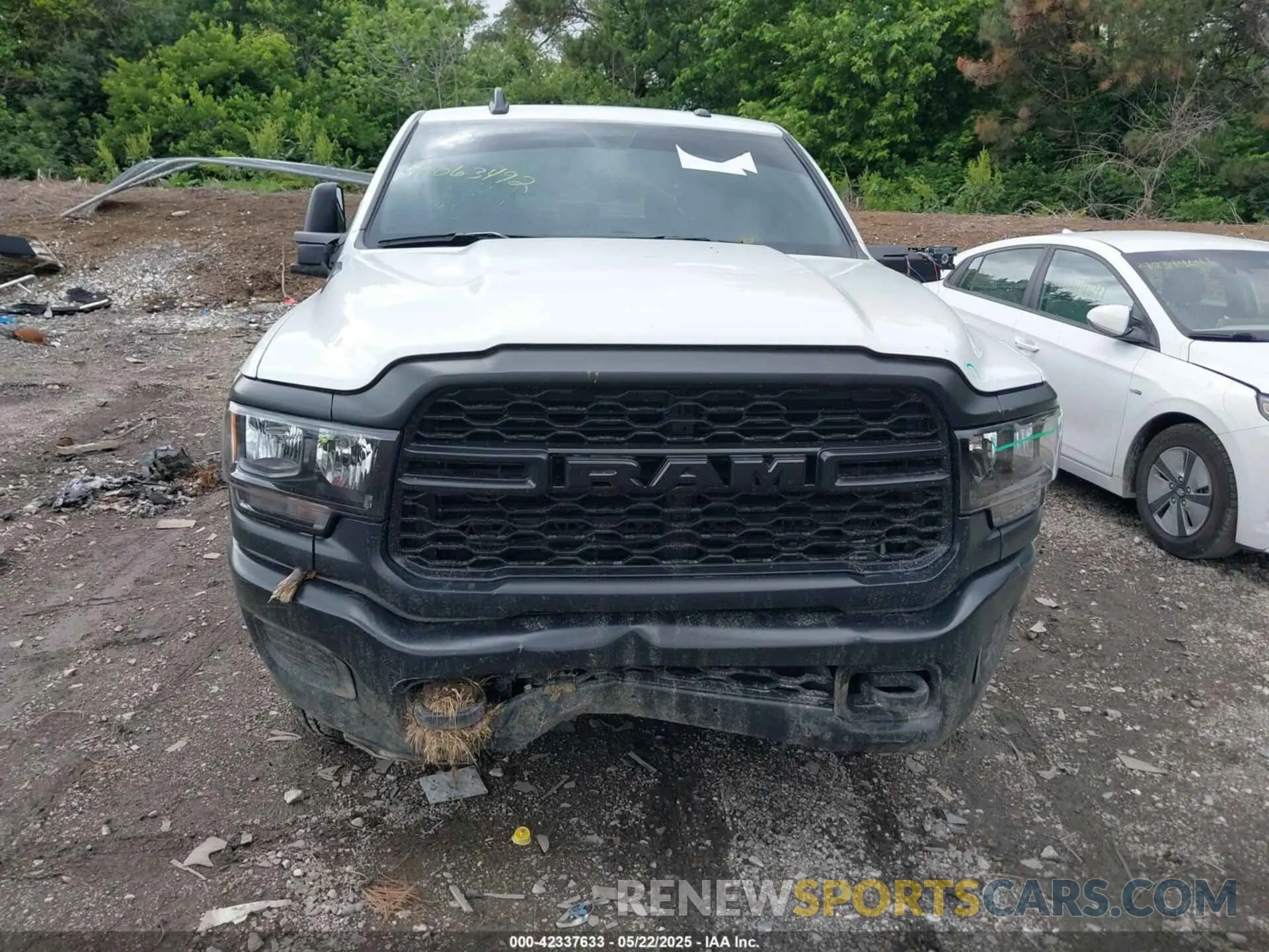 12 Photograph of a damaged car 3C6UR5CL9RG234339 RAM 2500 2024