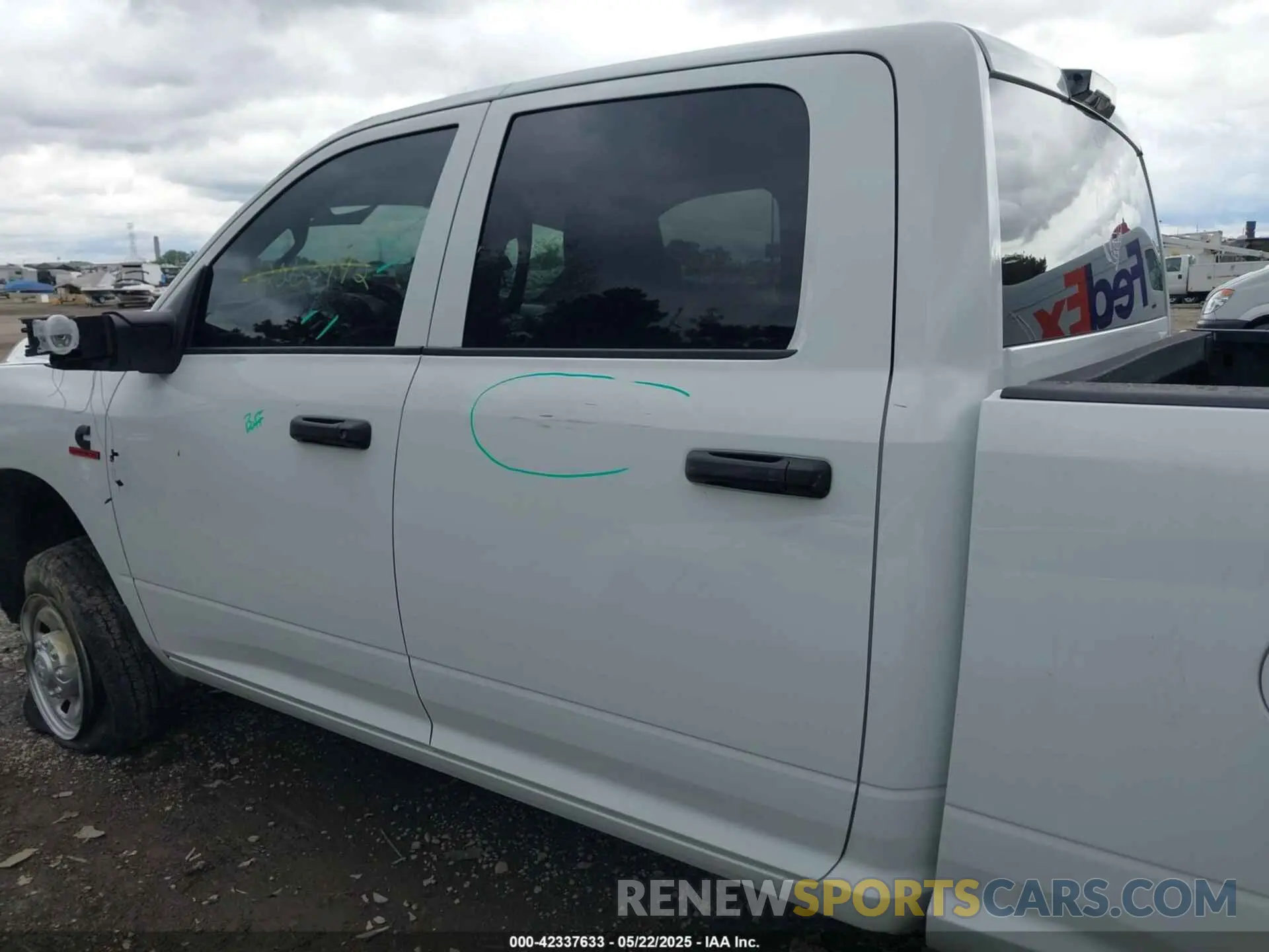 14 Photograph of a damaged car 3C6UR5CL9RG234339 RAM 2500 2024