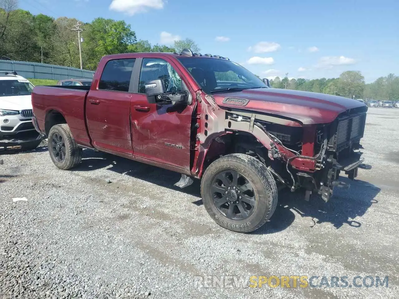 4 Photograph of a damaged car 3C6UR5DJ0RG178028 RAM 2500 2024