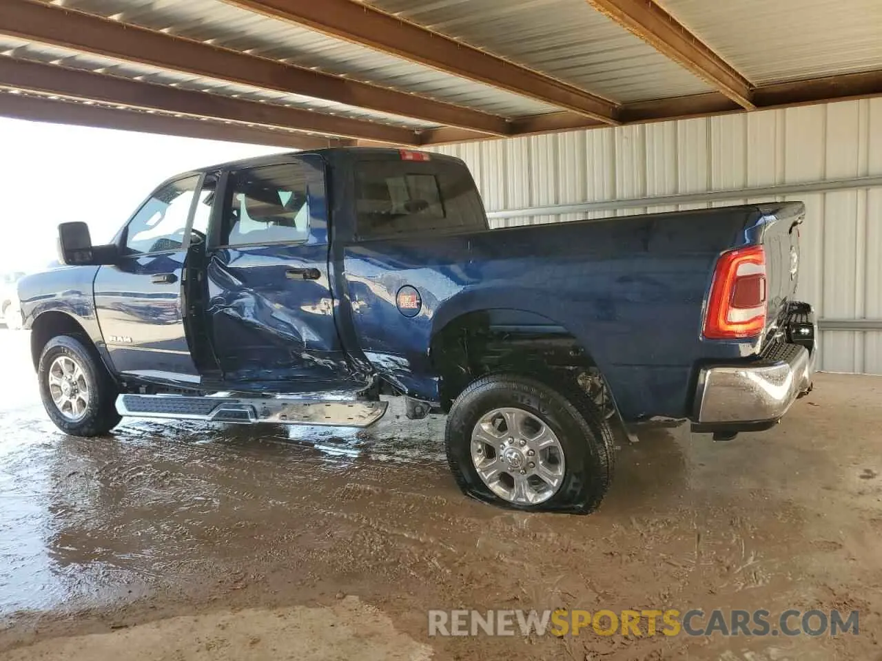 2 Photograph of a damaged car 3C6UR5DJ1RG381039 RAM 2500 2024