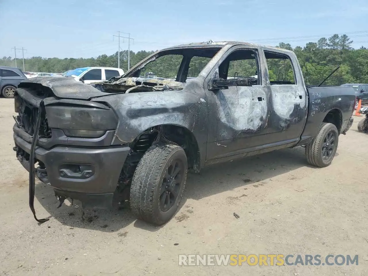 1 Photograph of a damaged car 3C6UR5DJ2RG186129 RAM 2500 2024
