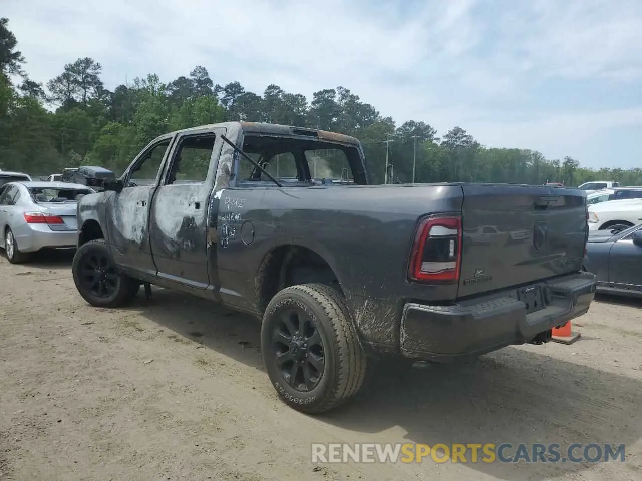 2 Photograph of a damaged car 3C6UR5DJ2RG186129 RAM 2500 2024