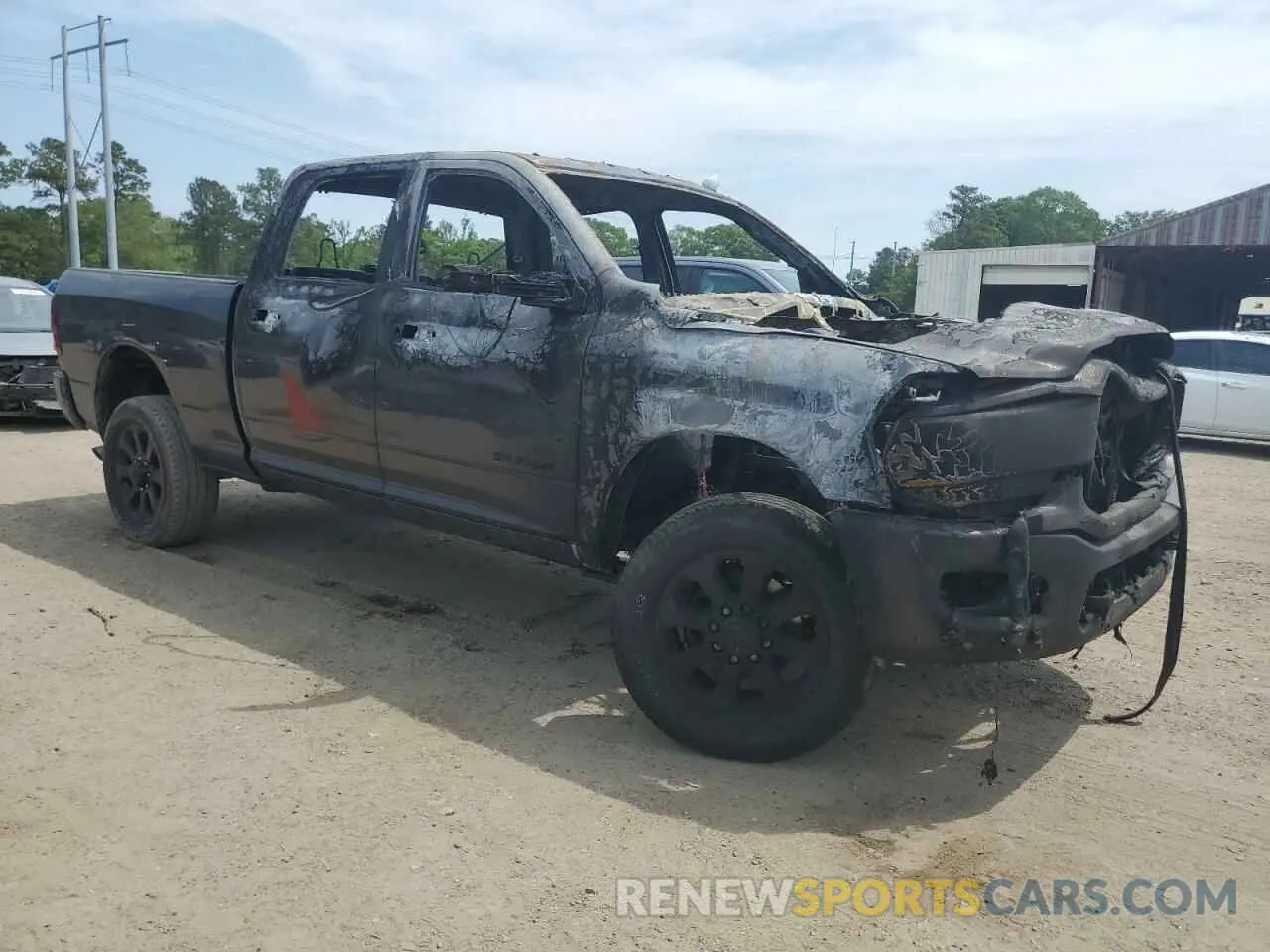 4 Photograph of a damaged car 3C6UR5DJ2RG186129 RAM 2500 2024