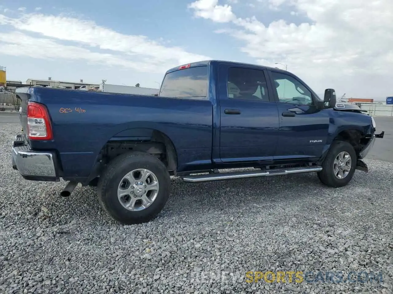 3 Photograph of a damaged car 3C6UR5DJ2RG323442 RAM 2500 2024