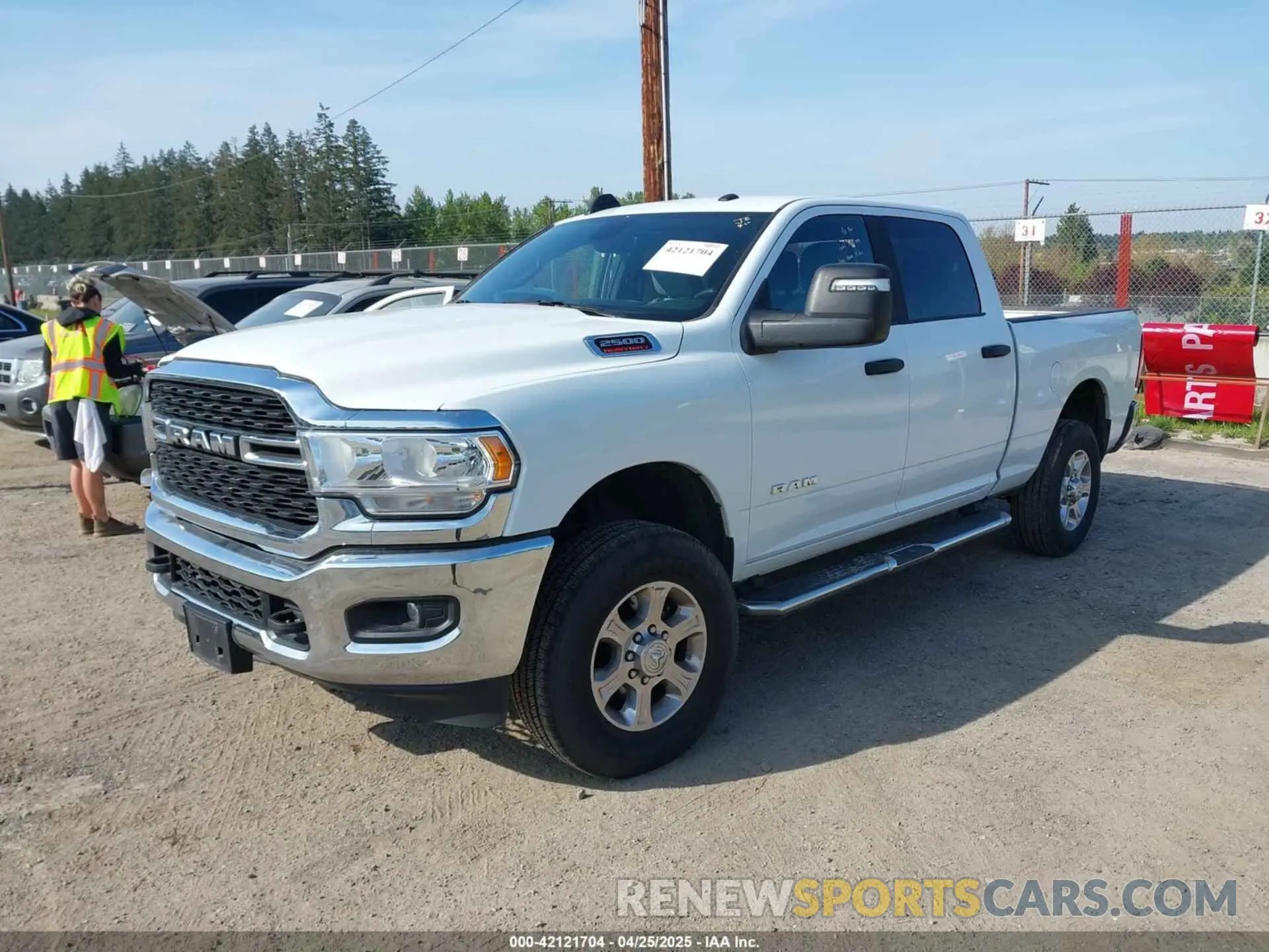 2 Photograph of a damaged car 3C6UR5DJ3RG275904 RAM 2500 2024