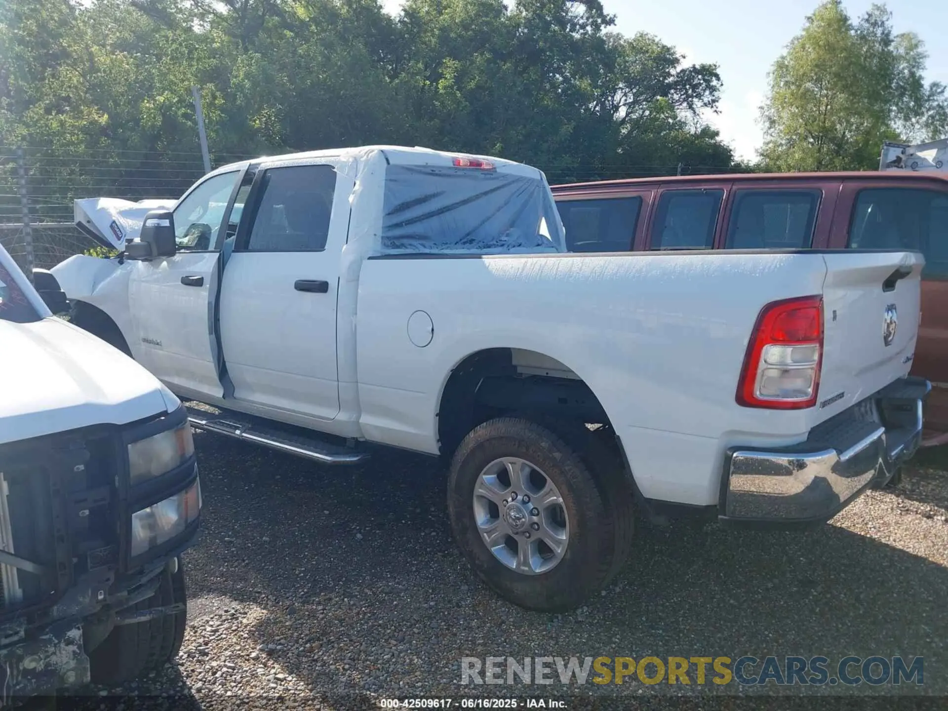 14 Photograph of a damaged car 3C6UR5DJ3RG366512 RAM 2500 2024