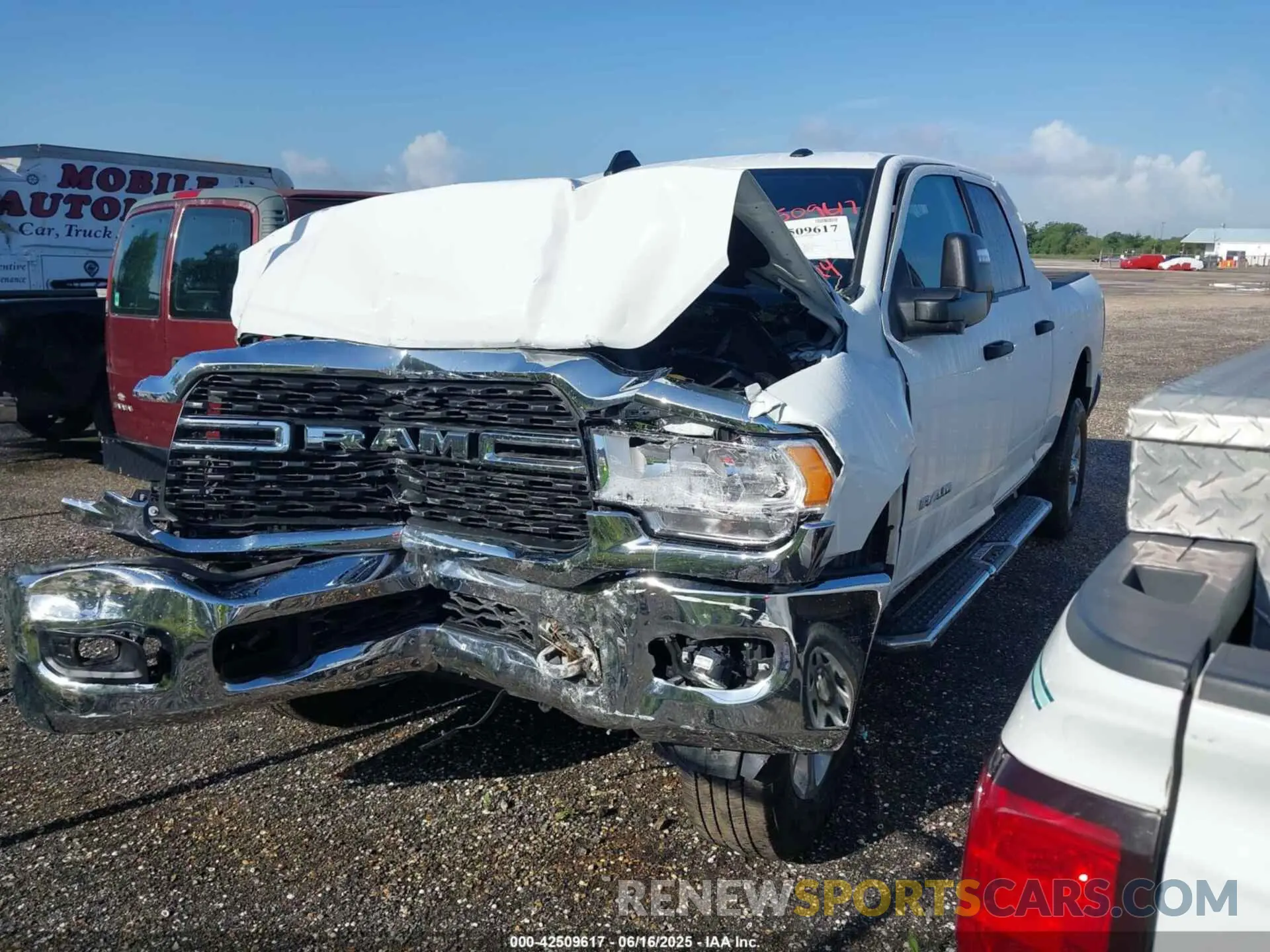 2 Photograph of a damaged car 3C6UR5DJ3RG366512 RAM 2500 2024