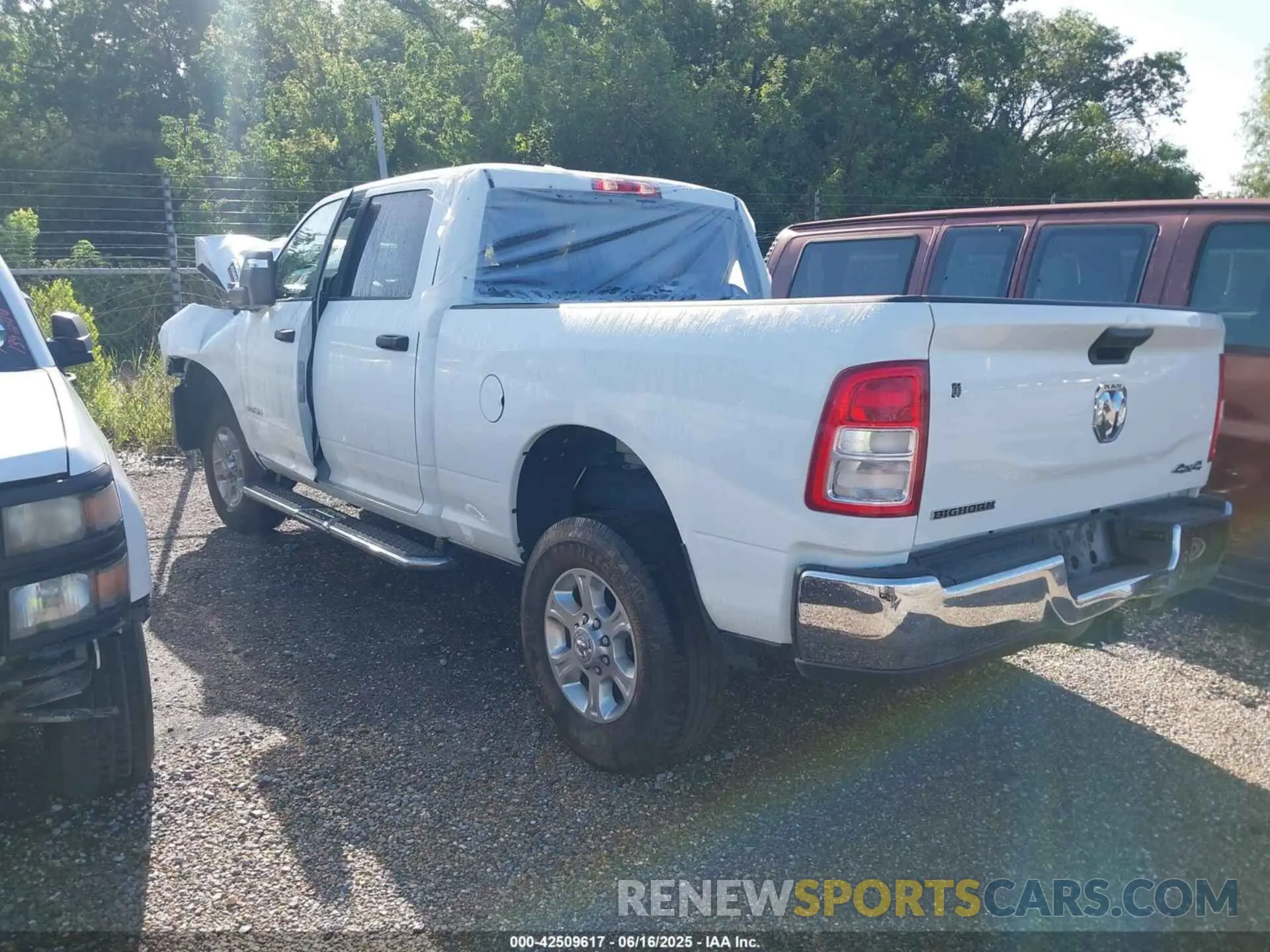 3 Photograph of a damaged car 3C6UR5DJ3RG366512 RAM 2500 2024