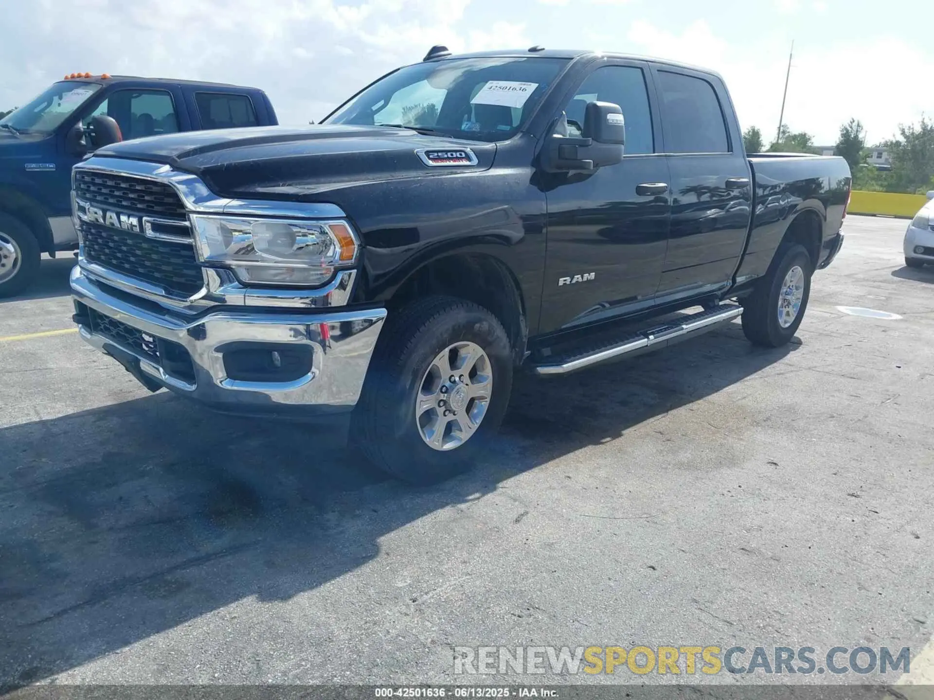 2 Photograph of a damaged car 3C6UR5DJ4RG311227 RAM 2500 2024