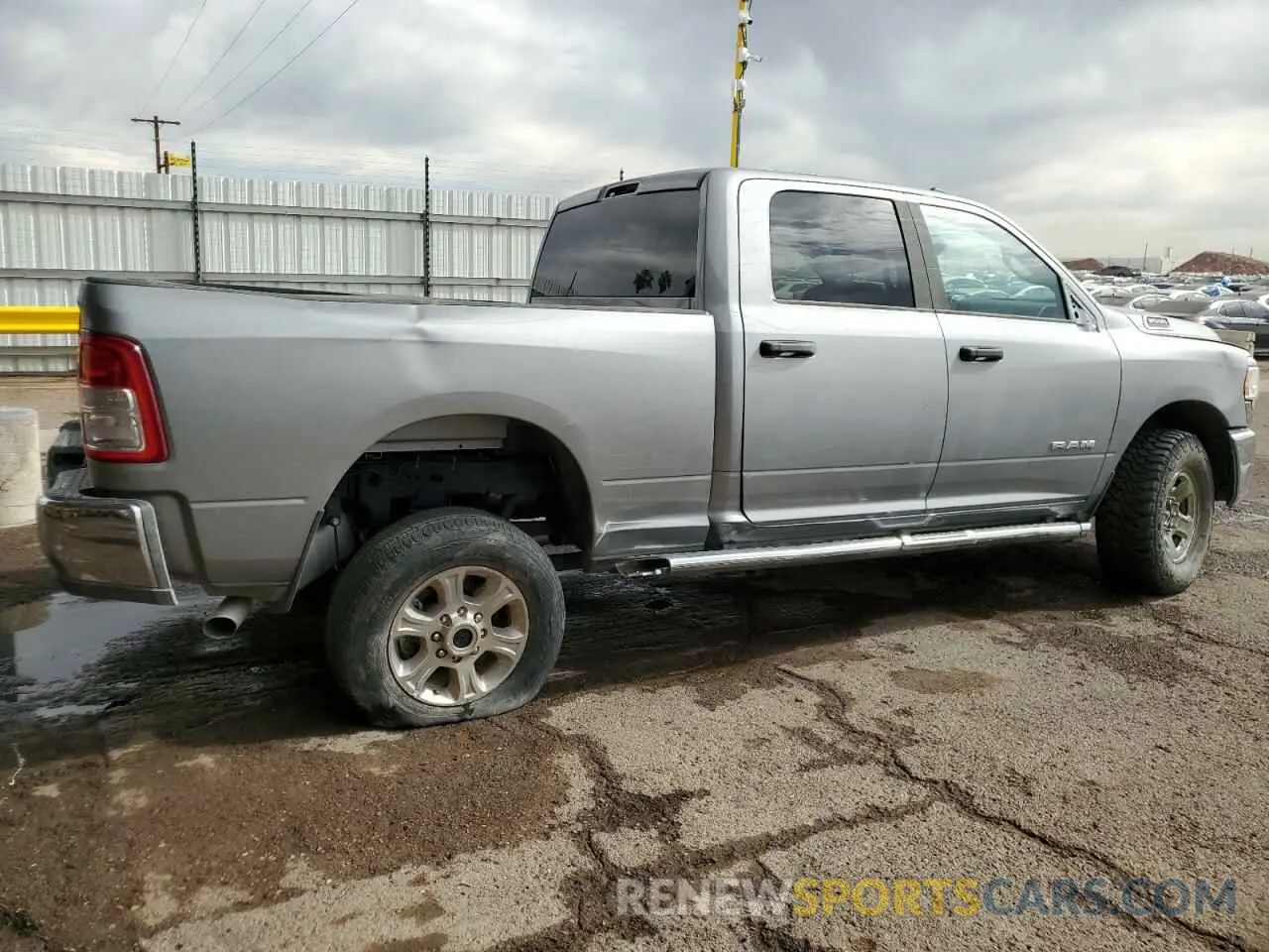 3 Photograph of a damaged car 3C6UR5DJ4RG323264 RAM 2500 2024