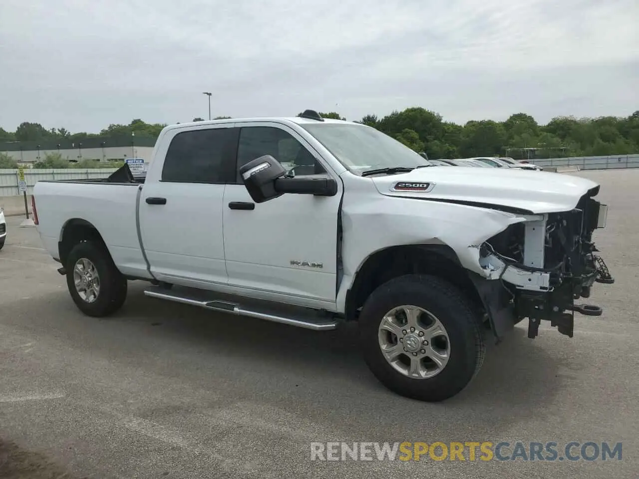 4 Photograph of a damaged car 3C6UR5DJ5RG373879 RAM 2500 2024