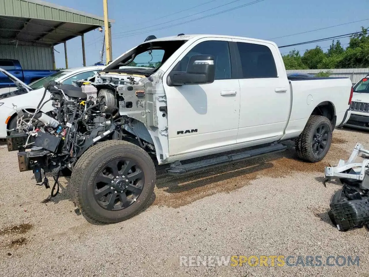 1 Photograph of a damaged car 3C6UR5DJ5RG397499 RAM 2500 2024