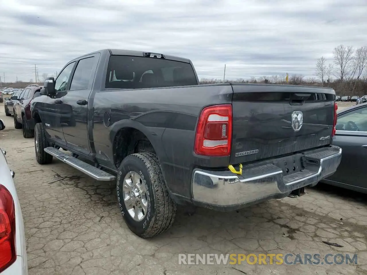 2 Photograph of a damaged car 3C6UR5DJ7RG138156 RAM 2500 2024