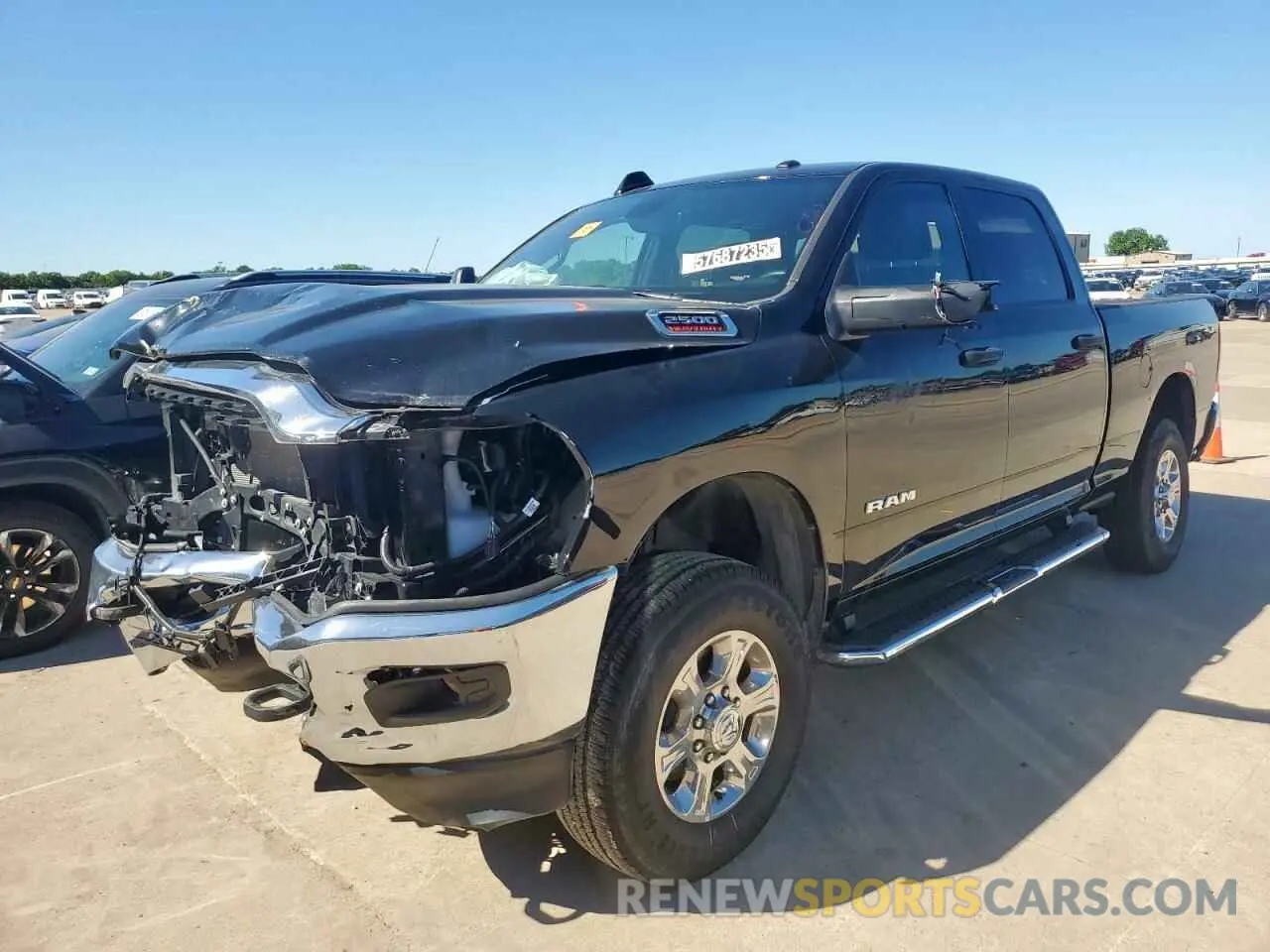 1 Photograph of a damaged car 3C6UR5DJ7RG322626 RAM 2500 2024