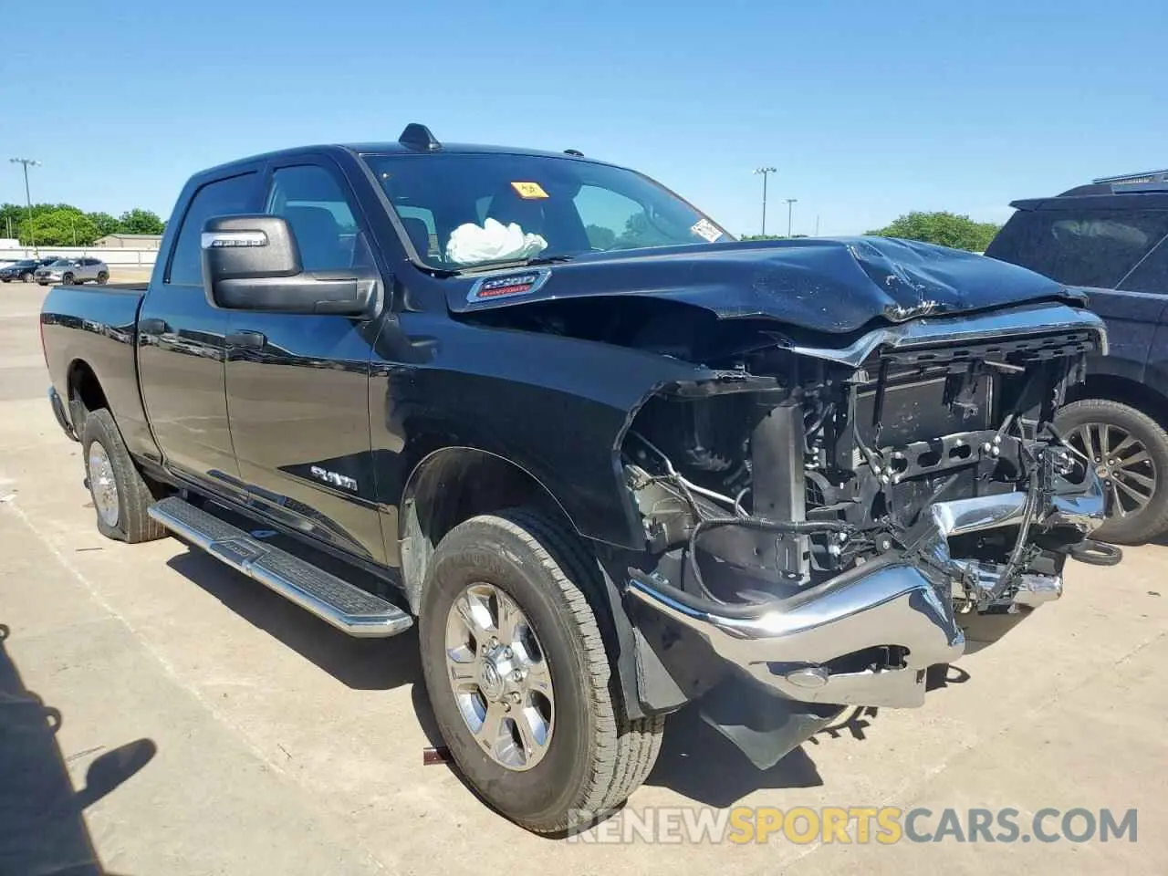 4 Photograph of a damaged car 3C6UR5DJ7RG322626 RAM 2500 2024