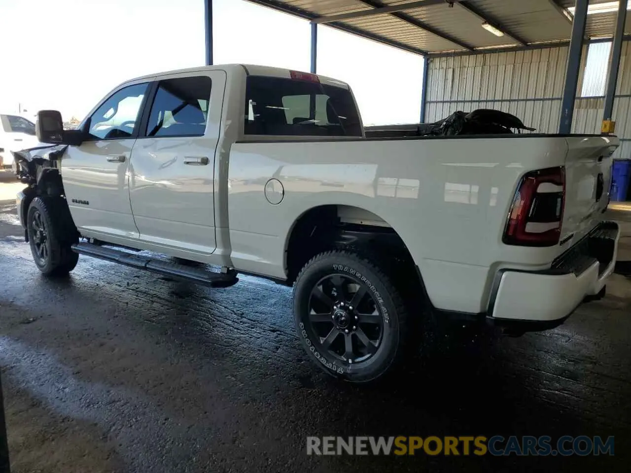 2 Photograph of a damaged car 3C6UR5DJ7RG394359 RAM 2500 2024