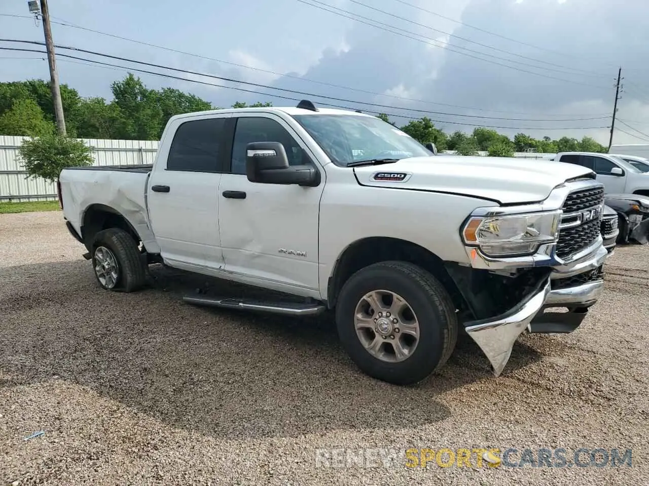 4 Photograph of a damaged car 3C6UR5DJ7RG412973 RAM 2500 2024