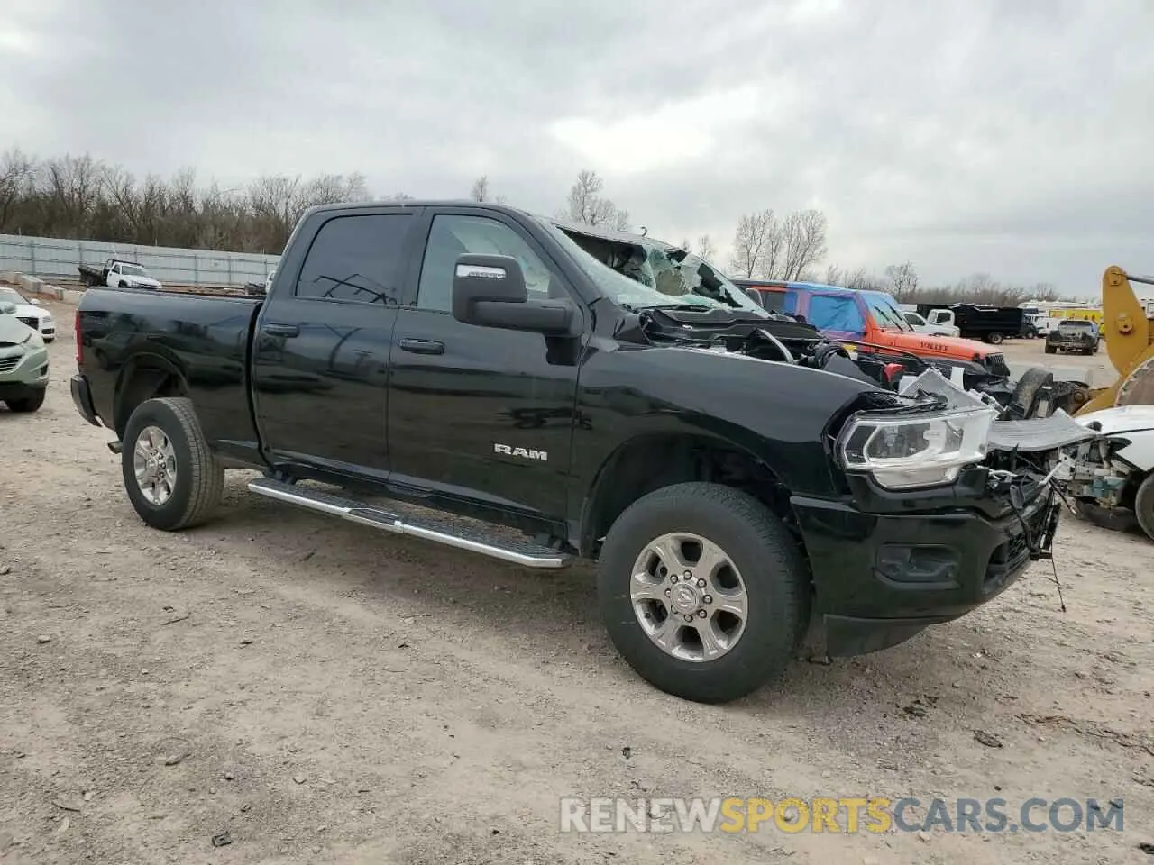 4 Photograph of a damaged car 3C6UR5DJ9RG386229 RAM 2500 2024