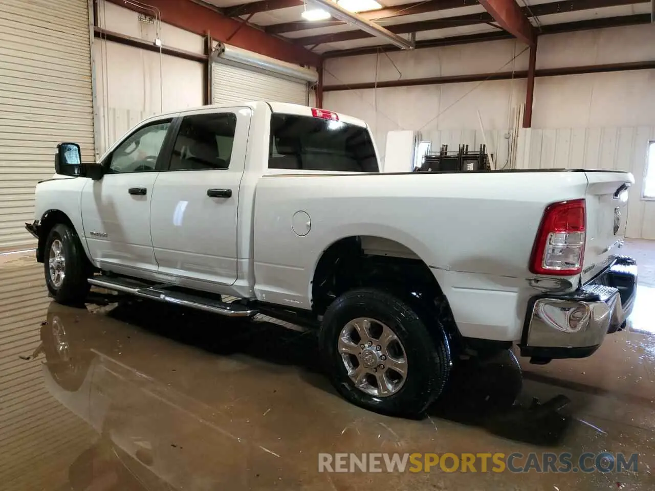 2 Photograph of a damaged car 3C6UR5DJXRG394811 RAM 2500 2024