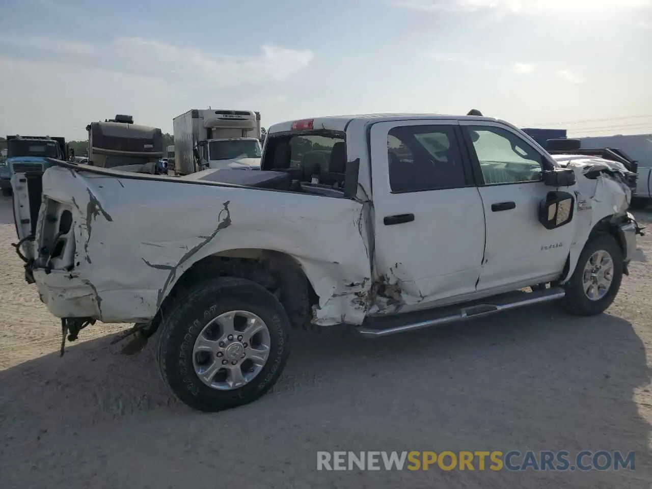 4 Photograph of a damaged car 3C6UR5DL0RG176975 RAM 2500 2024