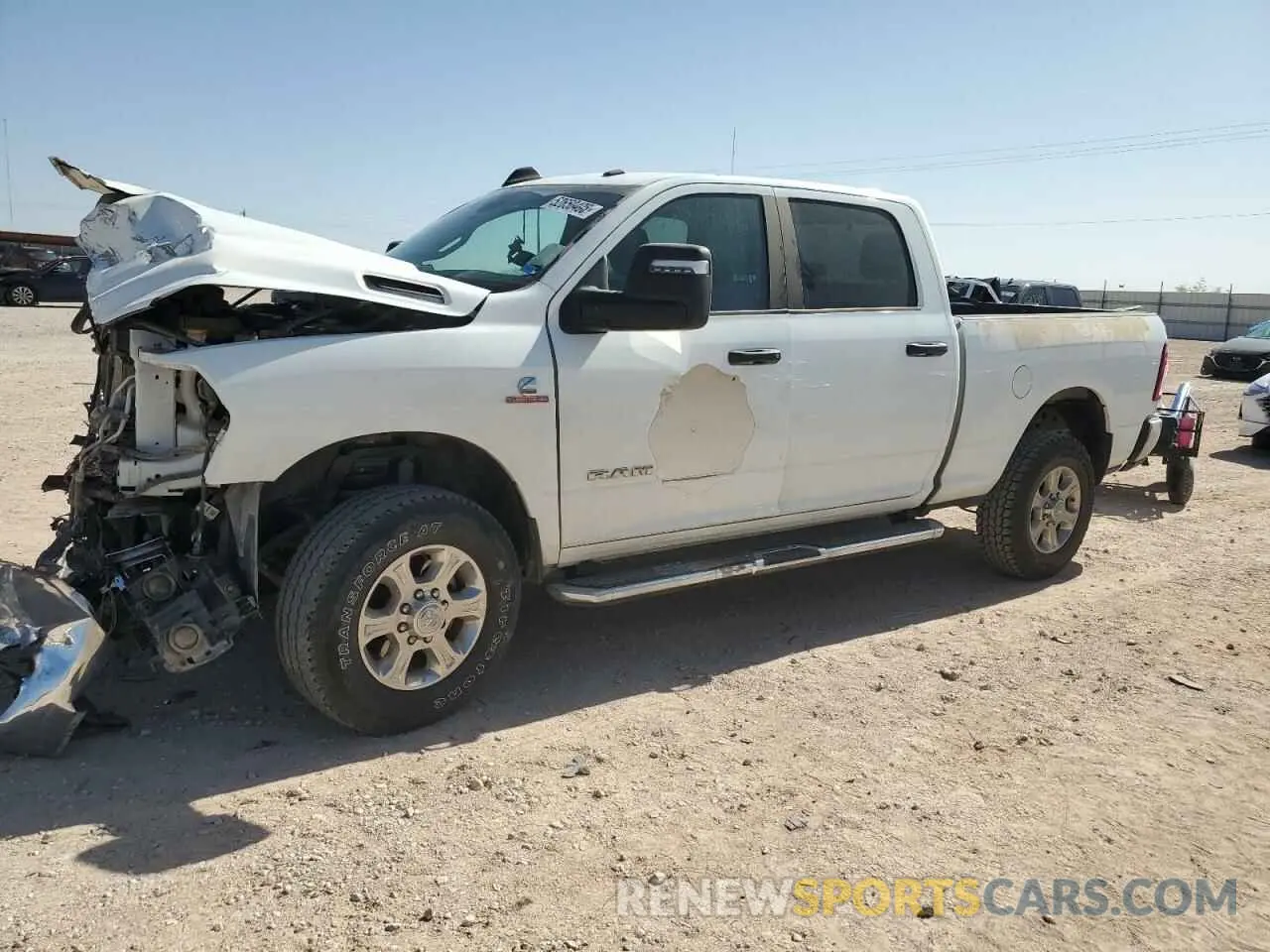 1 Photograph of a damaged car 3C6UR5DL1RG106160 RAM 2500 2024