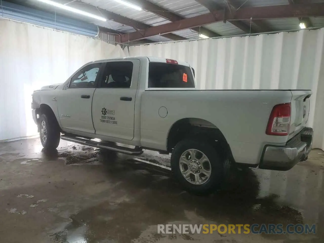 2 Photograph of a damaged car 3C6UR5DL2RG101498 RAM 2500 2024
