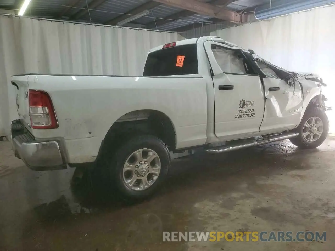 3 Photograph of a damaged car 3C6UR5DL2RG101498 RAM 2500 2024